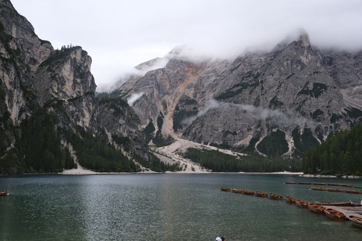 A quiet lake beneath dramatic mountains